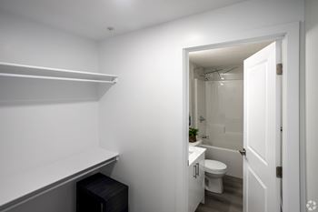 A white bathroom with a toilet and sink.